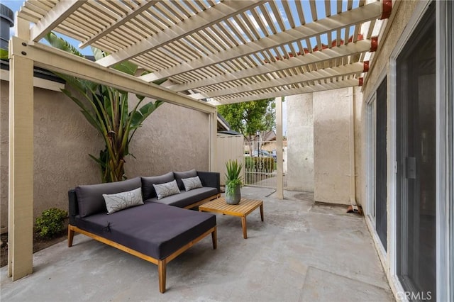 view of patio featuring a pergola, fence, and an outdoor living space
