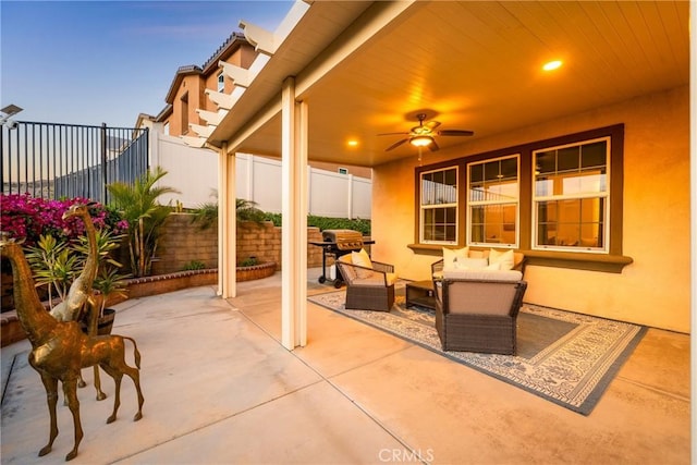 view of patio featuring an outdoor living space, fence, and area for grilling