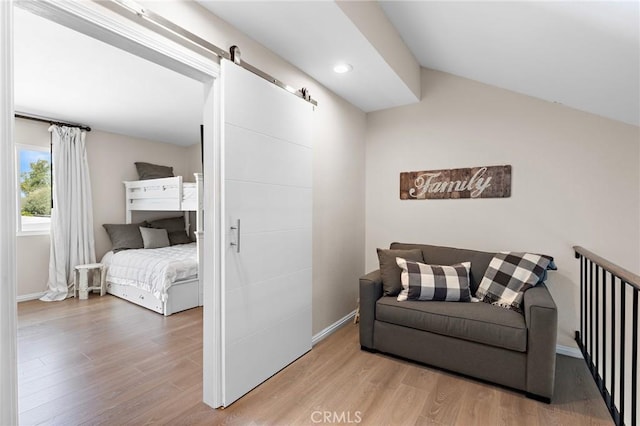 133 Morristown Ln, Costa Mesa, CA 92626 - bedroom with wood finished floors, a barn door, baseboards, lofted ceiling, and recessed lighting