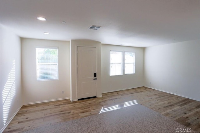 entryway with recessed lighting, wood finished floors, visible vents, and baseboards