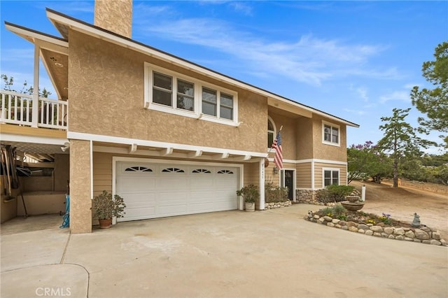 33435 Hubbard Rd, Acton, CA 93510 - view of front of house featuring an attached garage, driveway, and stucco siding