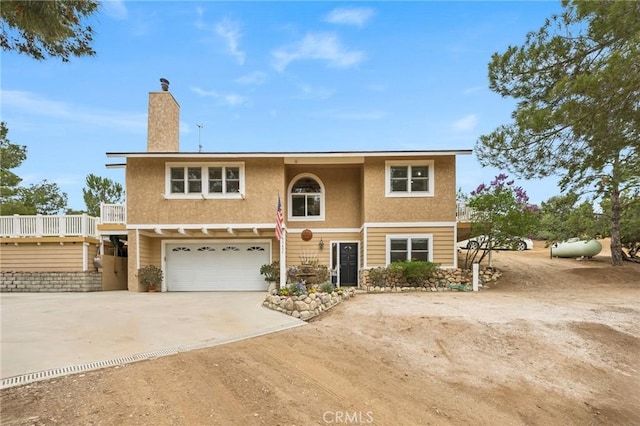 33435 Hubbard Rd, Acton, CA 93510 - traditional home featuring driveway, a garage, stucco siding, and a chimney