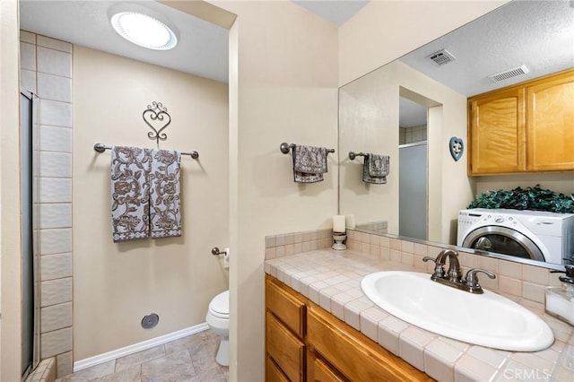 33435 Hubbard Rd, Acton, CA 93510 - bathroom with washer / dryer, a shower stall, and vanity