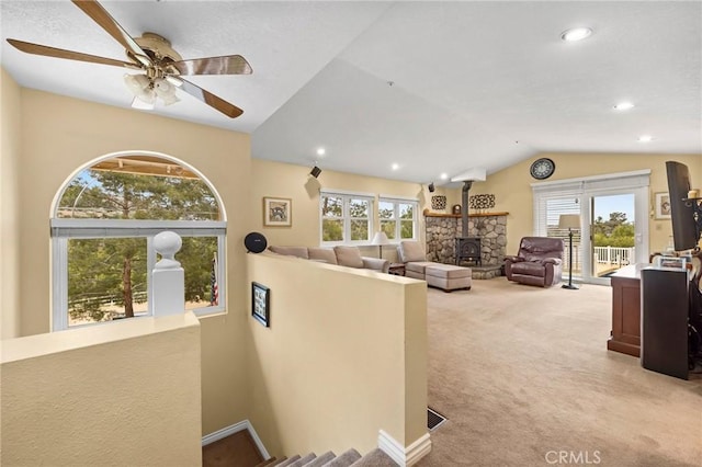 33435 Hubbard Rd, Acton, CA 93510 - living area with light colored carpet, lofted ceiling, ceiling fan, a wood stove, and recessed lighting