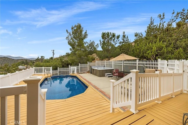 33435 Hubbard Rd, Acton, CA 93510 - view of swimming pool featuring a hot tub, a deck with mountain view, and a fenced backyard
