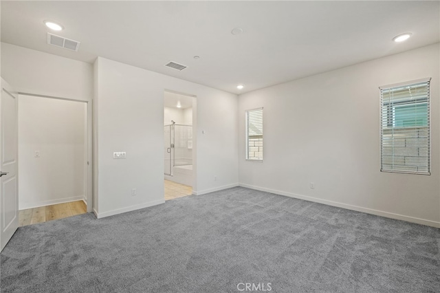 unfurnished bedroom with baseboards, visible vents, carpet floors, and recessed lighting