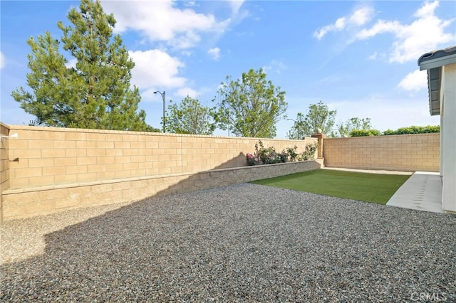 view of yard featuring a fenced backyard