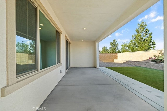 view of patio / terrace featuring fence
