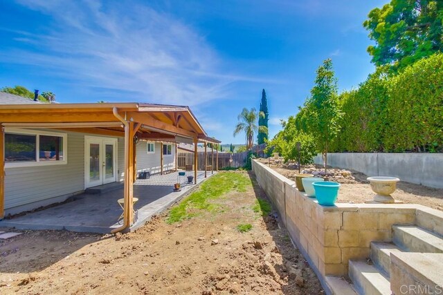 13522 Utopia Rd, Poway, CA 92064 - fenced backyard with french doors and a patio area