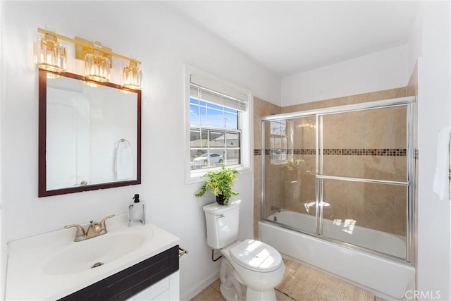 full bathroom with toilet, vanity, and combined bath / shower with glass door