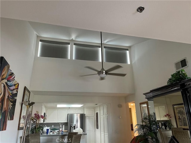 500 E Amado Rd Unit 420, Palm Springs, CA 92262 - living area with a ceiling fan and a towering ceiling