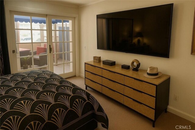 500 E Amado Rd Unit 420, Palm Springs, CA 92262 - bedroom featuring access to exterior, light colored carpet, ornamental molding, and baseboards