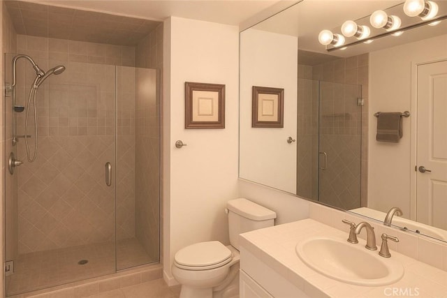 500 E Amado Rd Unit 420, Palm Springs, CA 92262 - bathroom with vanity, toilet, a stall shower, and tile patterned flooring