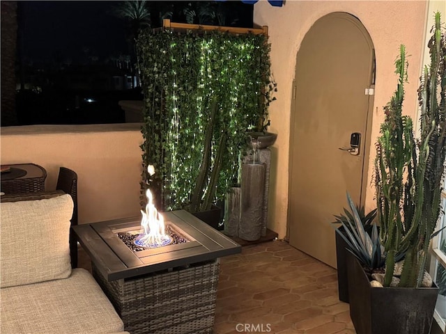 500 E Amado Rd Unit 420, Palm Springs, CA 92262 - view of patio / terrace with an outdoor fire pit