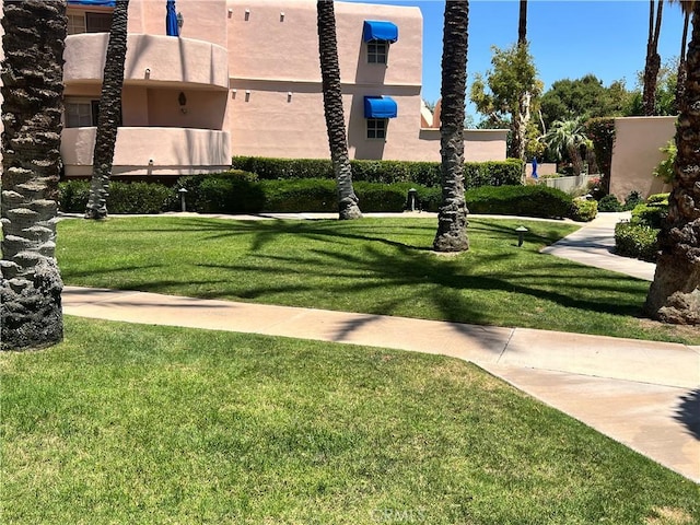500 E Amado Rd Unit 420, Palm Springs, CA 92262 - surrounding community with a lawn