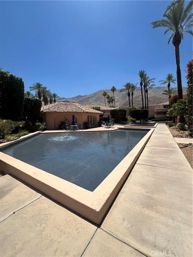 500 E Amado Rd Unit 420, Palm Springs, CA 92262 - community pool featuring a mountain view and a patio area