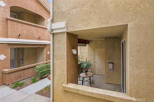 24909 Madison Ave Unit 1311, Murrieta, CA 92562 - property entrance with visible vents and stucco siding