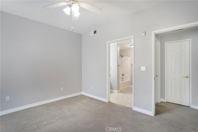24909 Madison Ave Unit 1311, Murrieta, CA 92562 - unfurnished bedroom featuring a ceiling fan, visible vents, baseboards, ensuite bathroom, and carpet flooring