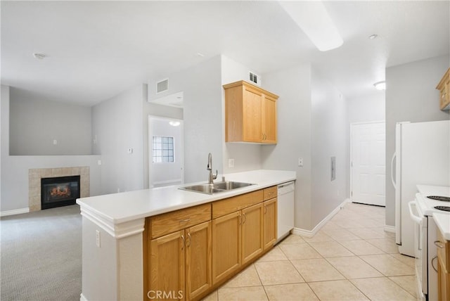 24909 Madison Ave Unit 1311, Murrieta, CA 92562 - kitchen with visible vents, a sink, a fireplace, and white appliances