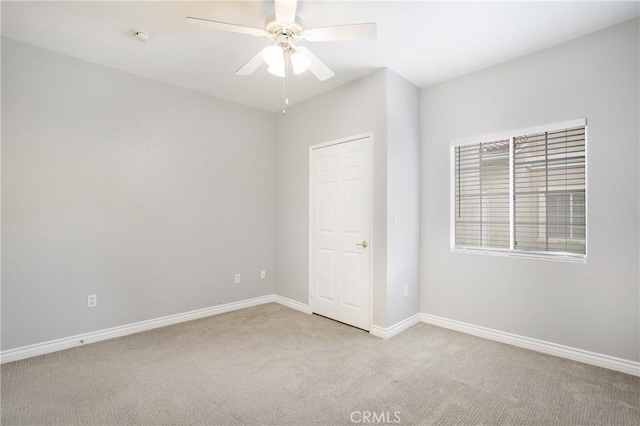 24909 Madison Ave Unit 1311, Murrieta, CA 92562 - unfurnished bedroom with baseboards, ceiling fan, and light carpet