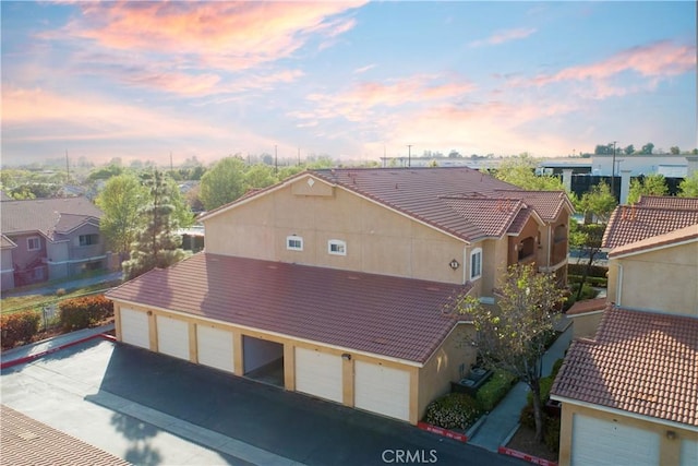 24909 Madison Ave Unit 1311, Murrieta, CA 92562 - aerial view at dusk with a residential view