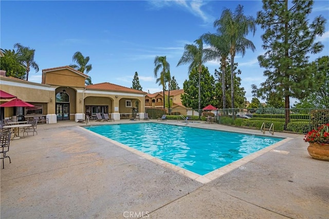 24909 Madison Ave Unit 1311, Murrieta, CA 92562 - pool featuring a patio, fence, and french doors