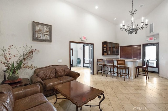 24909 Madison Ave Unit 1311, Murrieta, CA 92562 - living area featuring a high ceiling, a notable chandelier, recessed lighting, and visible vents
