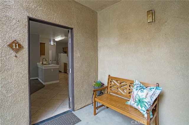 24909 Madison Ave Unit 1311, Murrieta, CA 92562 - entrance to property featuring stucco siding and a sink