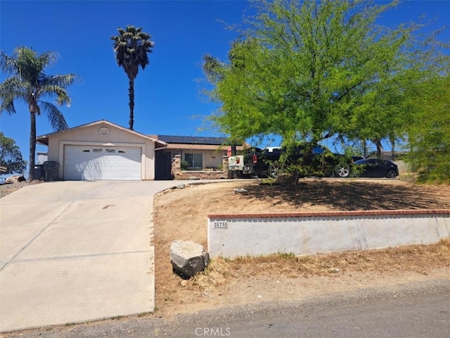 28755 Avenida Estrella, Menifee, CA 92587 - ranch-style home with an attached garage, stucco siding, solar panels, and driveway