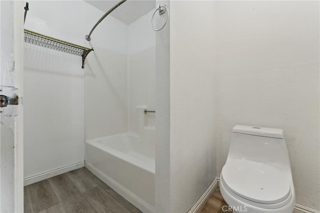 28755 Avenida Estrella, Menifee, CA 92587 - full bath featuring toilet, baseboards, wood finished floors, and bathtub / shower combination