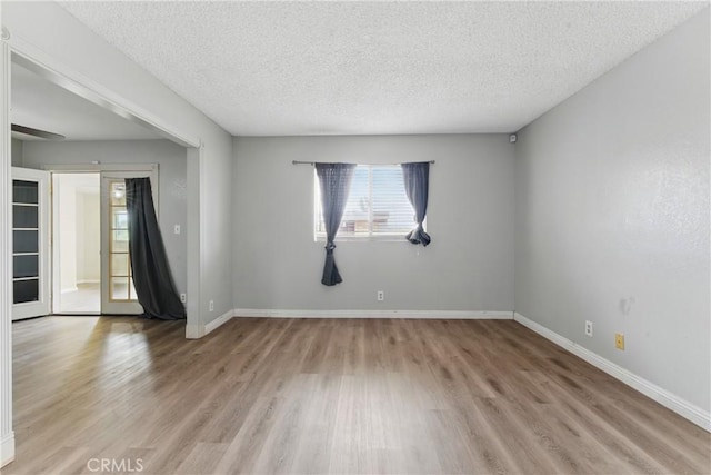 28755 Avenida Estrella, Menifee, CA 92587 - spare room with a textured ceiling, baseboards, and light wood-style floors