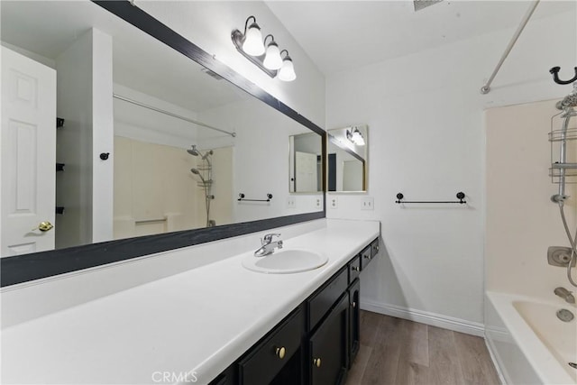28755 Avenida Estrella, Menifee, CA 92587 - full bath with baseboards, vanity, wood finished floors, and  shower combination