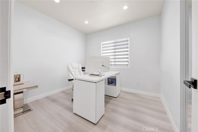 office with light wood-style floors, recessed lighting, and baseboards