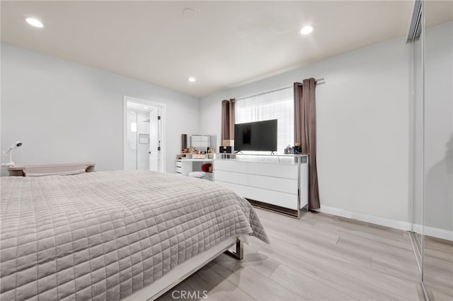 bedroom featuring recessed lighting, baseboards, and light wood-type flooring