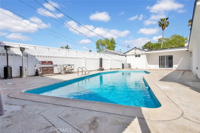 view of pool featuring central AC, fence, a patio area, and a fenced in pool