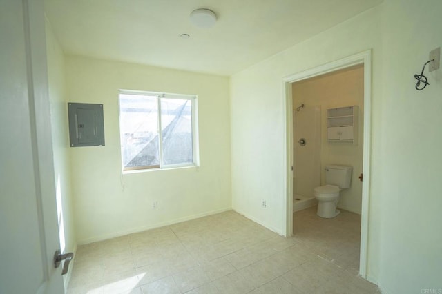 unfurnished bedroom with electric panel, baseboards, and light tile patterned floors