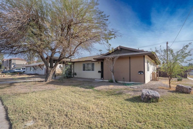 exterior space with a lawn and fence