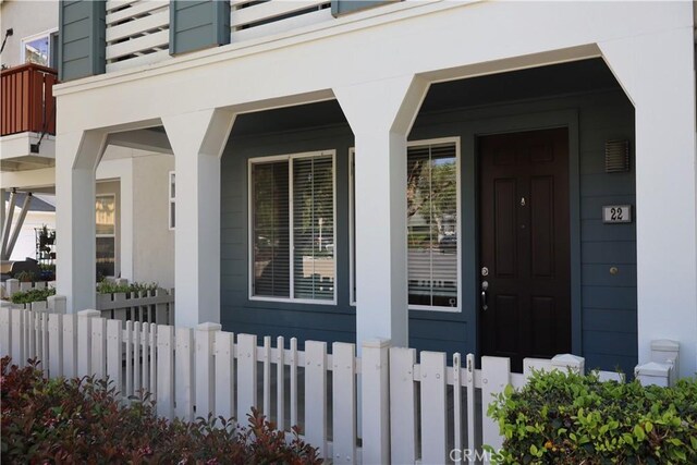 22 Platinum Cir, Ladera Ranch, CA 92694 - entrance to property featuring covered porch and stucco siding
