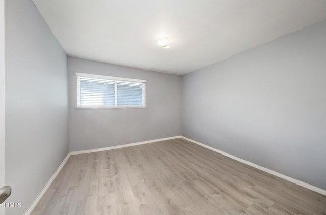 2430 Alexander St, Oxnard, CA 93033 - empty room with baseboards and wood finished floors