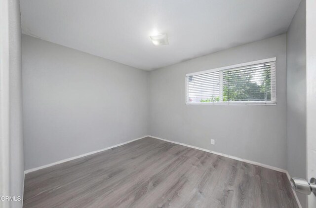 2430 Alexander St, Oxnard, CA 93033 - empty room with baseboards and wood finished floors