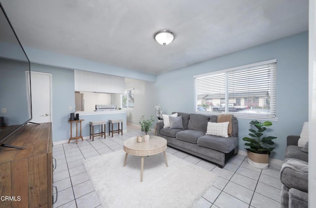 2430 Alexander St, Oxnard, CA 93033 - living area featuring light tile patterned floors, baseboards, and plenty of natural light