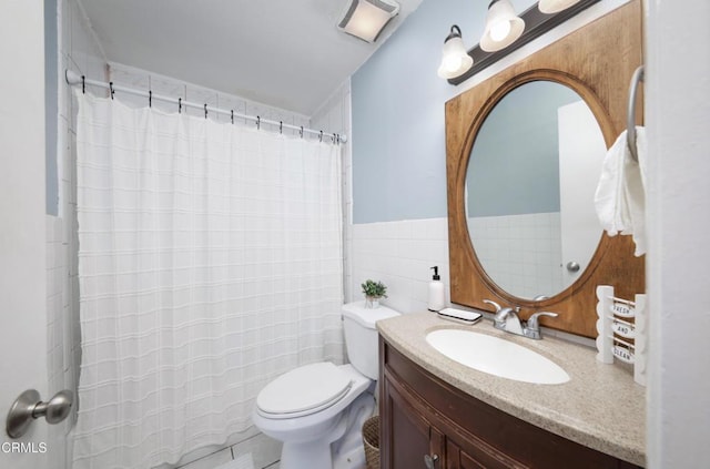 2430 Alexander St, Oxnard, CA 93033 - bathroom with tile walls, vanity, curtained shower, and wainscoting