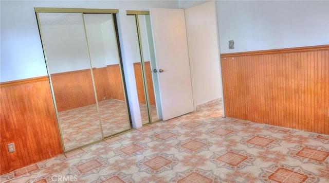 interior space with wooden walls and wainscoting