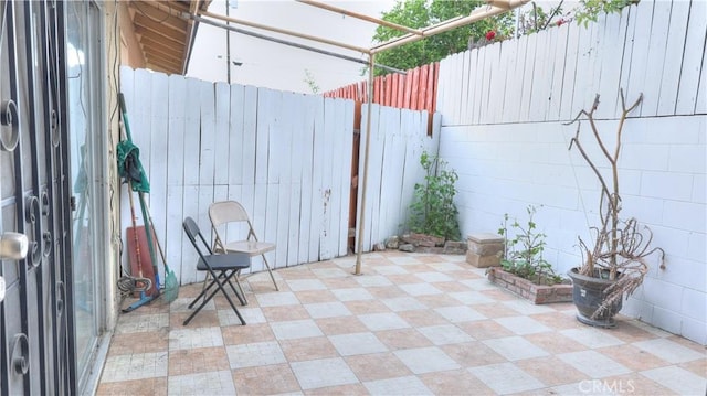 view of patio / terrace featuring fence