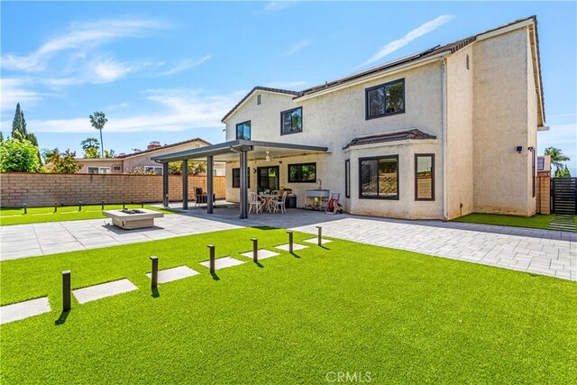 760 Featherwood Dr, Diamond Bar, CA 91765 - rear view of property featuring a fire pit, a patio, and stucco siding