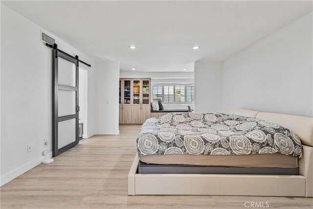 760 Featherwood Dr, Diamond Bar, CA 91765 - bedroom featuring a barn door, recessed lighting, wood finished floors, and baseboards