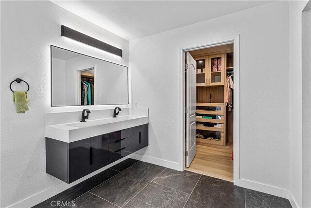 760 Featherwood Dr, Diamond Bar, CA 91765 - full bathroom featuring a spacious closet, baseboards, and vanity