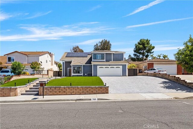 760 Featherwood Dr, Diamond Bar, CA 91765 - traditional-style house featuring driveway, roof mounted solar panels, and a garage