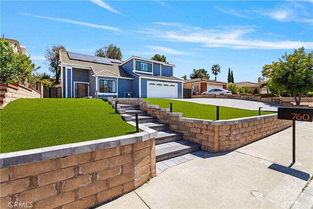 760 Featherwood Dr, Diamond Bar, CA 91765 - view of front of house featuring solar panels, driveway, and a garage