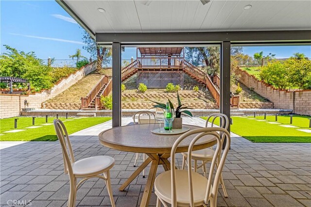 760 Featherwood Dr, Diamond Bar, CA 91765 - view of patio / terrace featuring stairs, a fenced backyard, and outdoor dining space